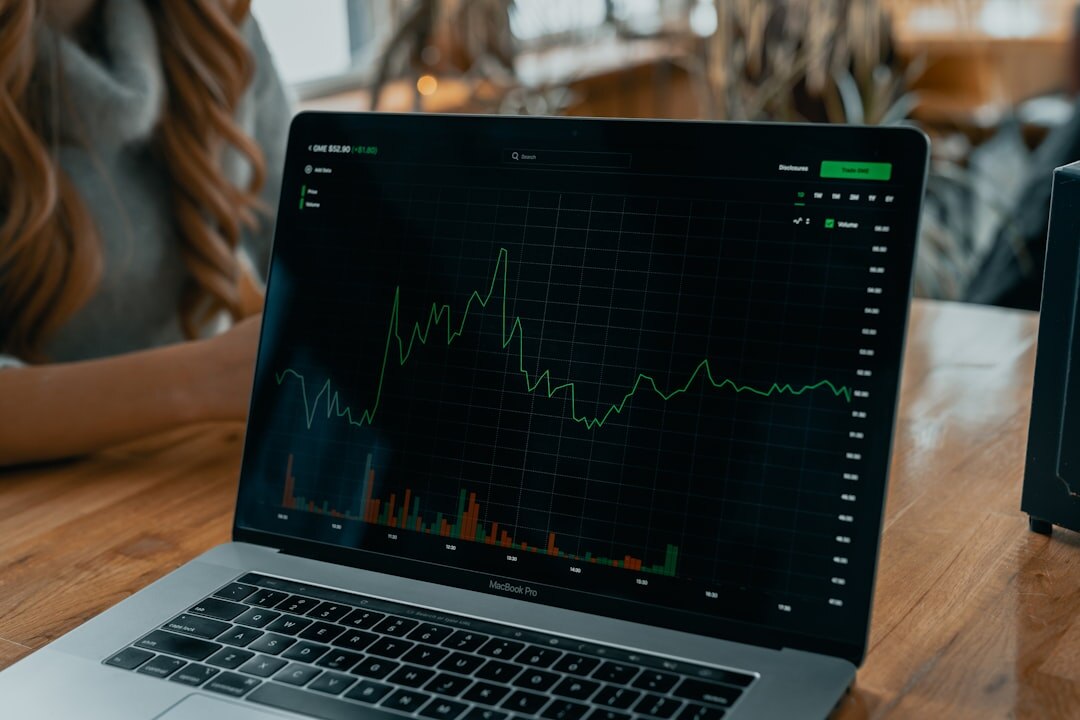 Laptop screen showing analytics charts and graphs